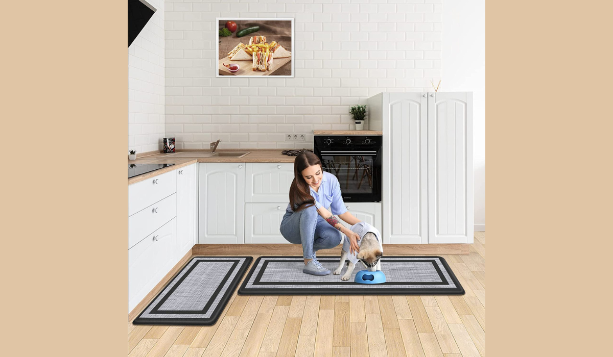 woman and dog in kitchen with floor mats