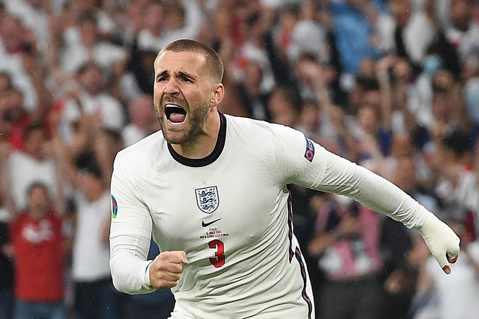 TOPSHOT - England's defender Luke Shaw celebrates after scoring the opening goal during the UEFA EURO 2020 final football match between Italy and England at the Wembley Stadium in London on July 11, 2021. (Photo by Andy Rain / POOL / AFP) (Photo by ANDY RAIN/POOL/AFP via Getty Images)