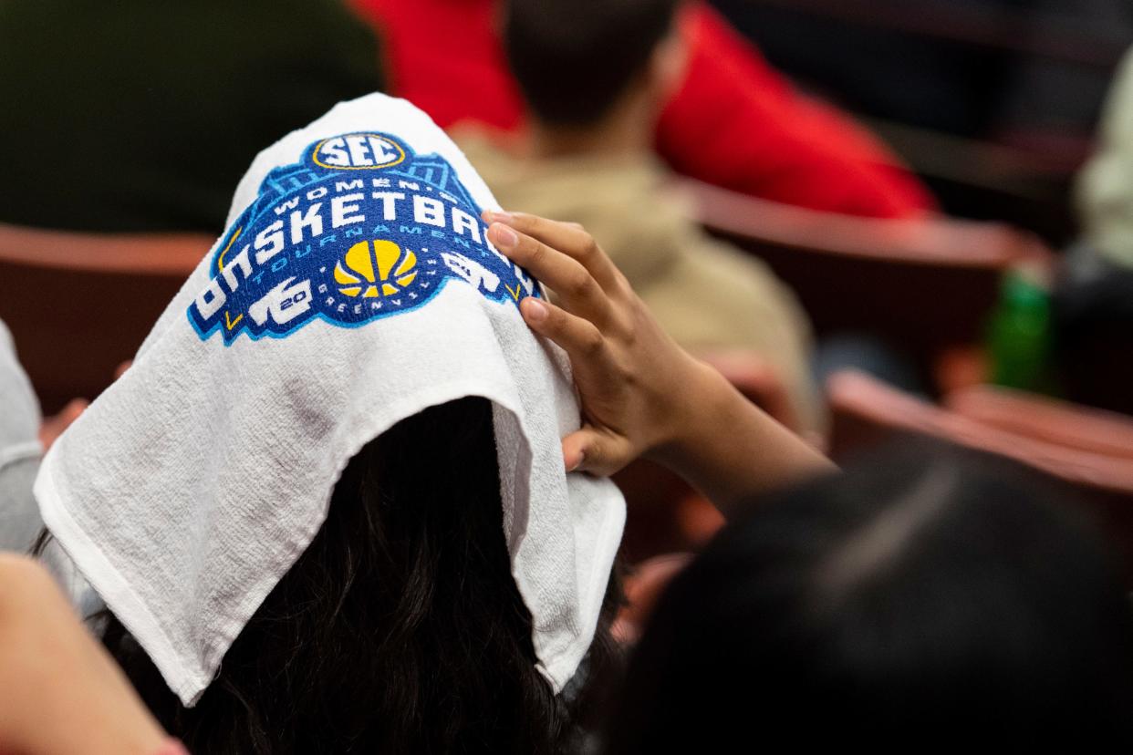 A young fan adjusts a towel on his head during game one of the SEC Women's Basketball tournament as University of Kentucky plays University of Georgia at Bon Secours Wellness Arena on Wednesday, March 6, 2024.