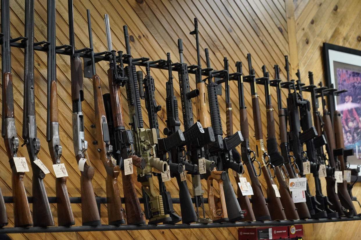 Various guns are displayed at a store on July 18, 2022, in Auburn, Maine. (Robert F. Bukaty/AP)