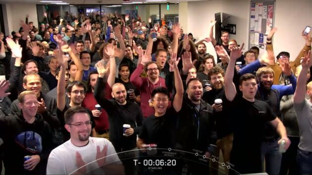 SpaceX employees in Redmond, Wash., give a cheer during the countdown to the Falcon 9 launch. SpaceX’s Starlink satellites are designed and built in Redmond. (SpaceX via YouTube)