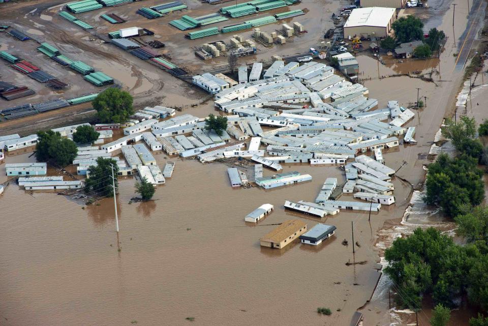 An aerial view of mobile homes submerged in flood waters along the South Platte River near Greenley, Colorado September 14, 2013. Farming communities along the South Platte River were ordered to evacuate ahead of a predicted surge in the flooding which may have claimed a fifth life and has left many still unaccounted for, according to authorities. REUTERS/John Wark