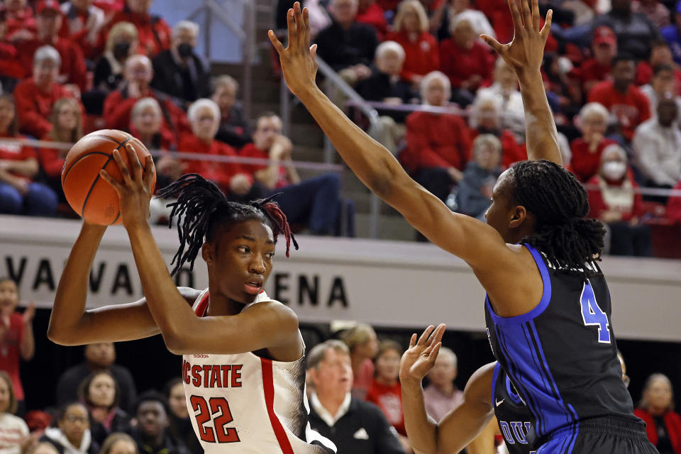 North Carolina State's Saniya Rivers (22) tries to pass the ball around Duke's Jadyn Donovan (4) during the first half of an NCAA college basketball game, Sunday, Jan. 21, 2024, in Raleigh, N.C. (AP Photo/Karl B. DeBlaker)