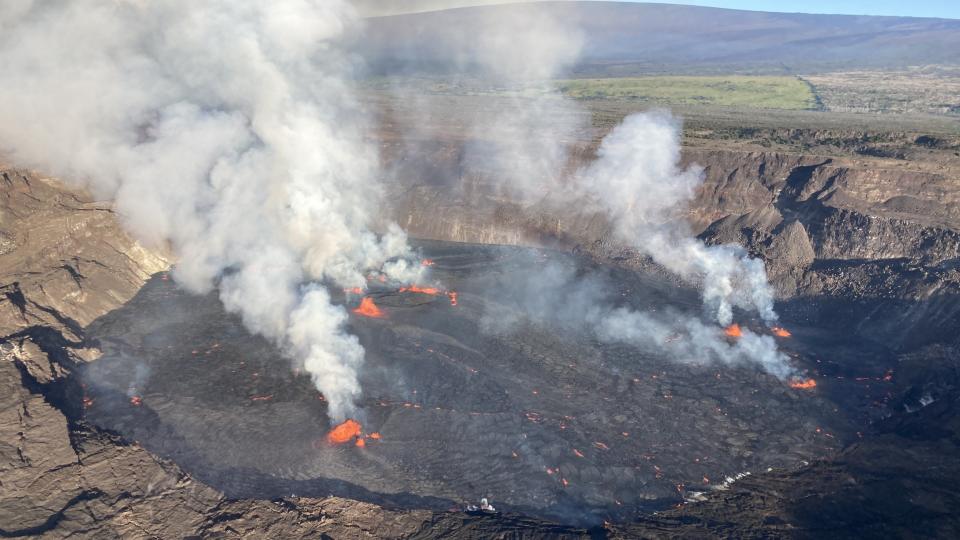 Smoke coming off of a volcano during the day