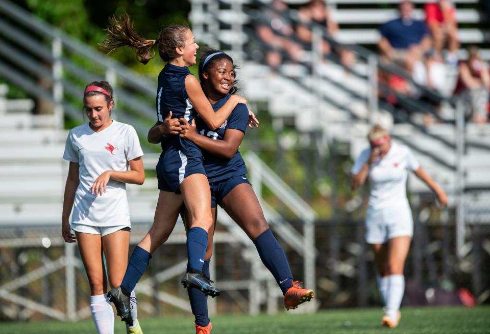 Montgomery Academy’s Hayes Jenkins (1) and Kaitlin Phenix celebrate after Jenkins’ goal during the second round of the AHSAA soccer playoffs at Montgomery Academy in Montgomery, Ala., on Tuesday, May 3, 2022. Montgomery Academy defeated St. Michael 3-0.