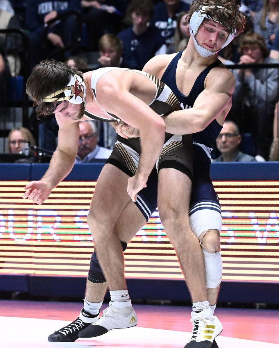 Penn State’s Levi Haines, right, battles Lehigh’s Max Brignola (157 lbs) during Sunday’s match at Rec Hall at Penn State. Haines defeated Brignola, 11-6. Penn State defeated Lehigh, 30-10.