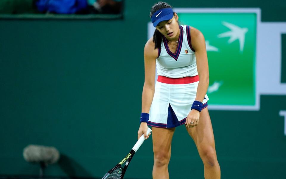 Emma Raducanu reacts after losing a point - Mark J. Terrill/AP