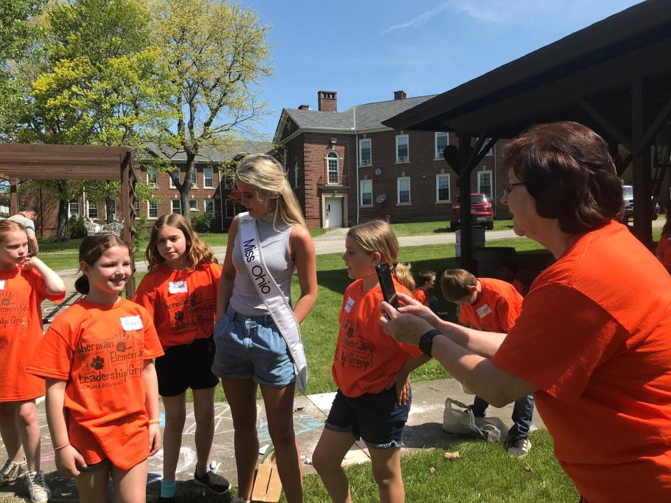 Miss Ohio Lora Current lets Sherman Elementary School girls                try on her crown at Dayspring Friday at the annual picnic with residents, sponsored by Doc Stumbo and Sherman Elementary.