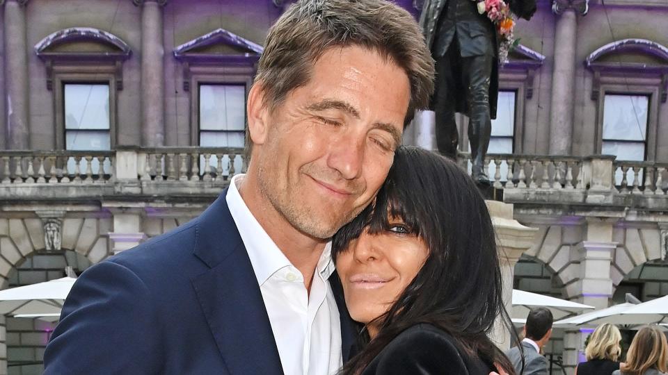 Kris Thykier and Claudia Winkleman hug in London wearing suits