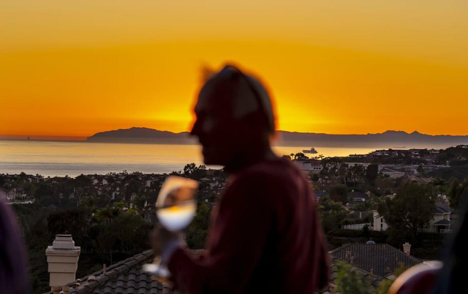 <div class="inline-image__caption"><p>A guest enjoys a glass of wine on the outdoor patio at the Bottega Angelina as the sun sets over Catalina Island.</p></div> <div class="inline-image__credit">MediaNews Group/Orange County Register via Getty Images</div>