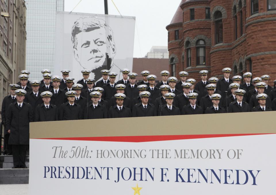 U.S. Naval Academy men's glee club members stand in in Dealey Plaza during ceremonies marking the 50th anniversary of JFK's assassination in Dallas