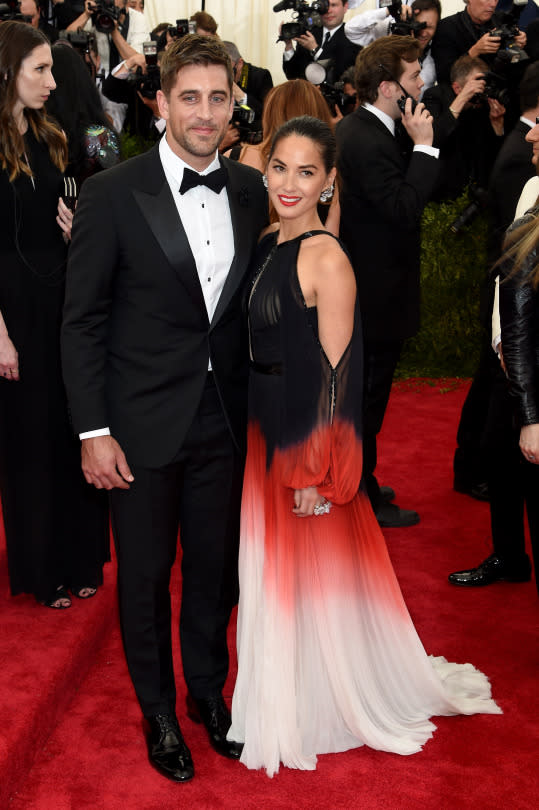 Olivia Munn in J. Mendel with Aaron Rodgers.