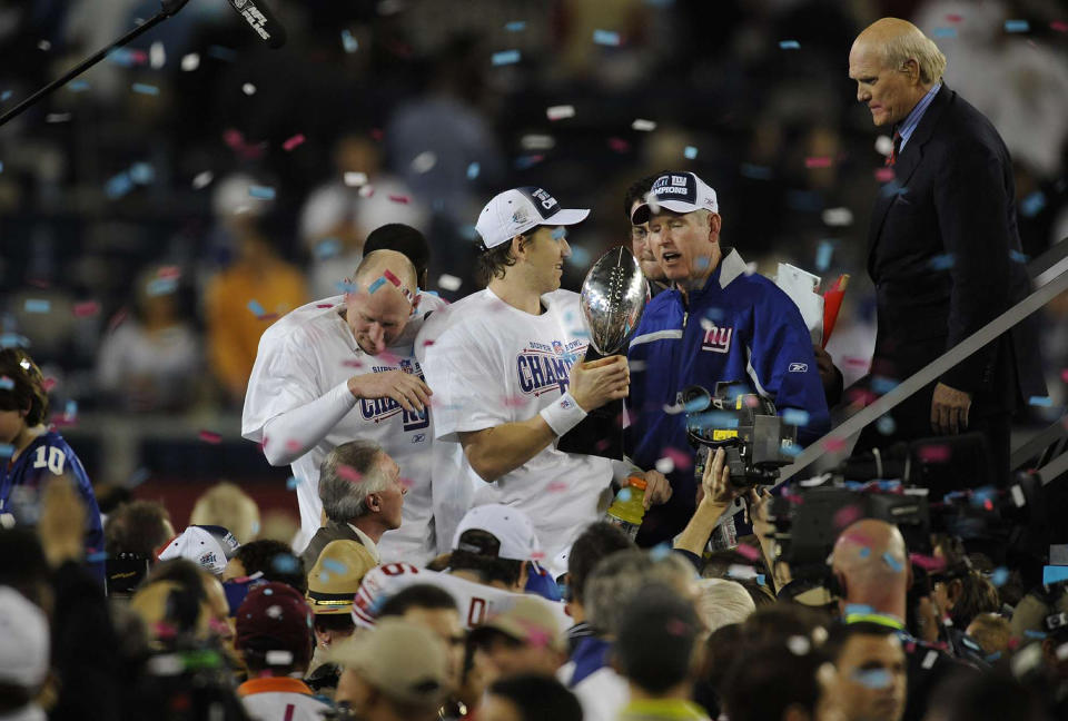 GLENDALE, AZ - FEBRUARY 3: Eli Manning #10 and head coach Tom Coughlin of New York Giants players celebrates with the Lombardi Trophy after the Giants defeated the New England Patriots in Super Bowl XLII on February 3, 2008 at University of Phoenix Stadium in Glendale, Arizona. The Giants won the game 17-14. (Photo by Focus on Sport/Getty Images) *** Eli Manning; Tom Coughlin