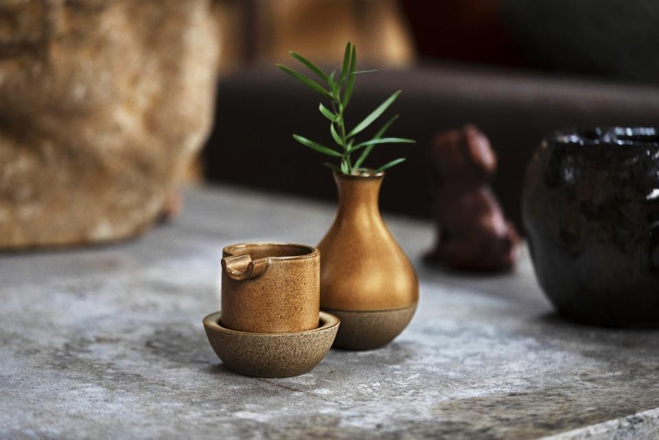 A three-piece ashtray set sitting on a table.