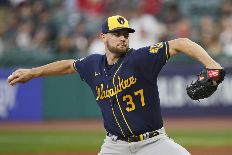 Milwaukee Brewers starting pitcher Adrian Houser delivers in the first inning of a baseball game against the Cleveland Indians, Friday, Sept. 10, 2021, in Cleveland. (AP Photo/Tony Dejak)
