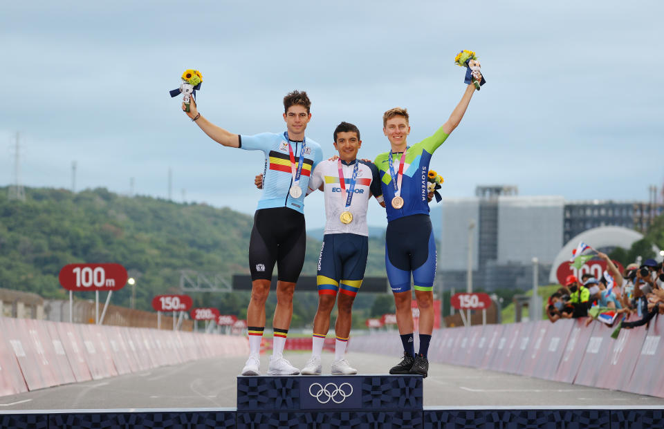 OYAMA, JAPAN - JULY 24: (L-R) Silver medalist Wout van Aert of Team Belgium, gold medalist Richard Carapaz of Team Ecuador, and bronze medalist Tadej Pogacar of Team Slovenia, pose on the podium during the medal ceremony during the Men's road race at the Fuji International Speedway on day one of the Tokyo 2020 Olympic Games on July 24, 2021 in Oyama, Shizuoka, Japan. (Photo by Tim de Waele/Getty Images)