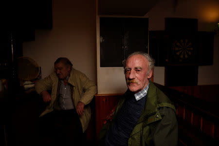 Stephen Burns drinks in a pub on the Northern Ireland side of Belleek, February 20, 2018. REUTERS/Clodagh Kilcoyne