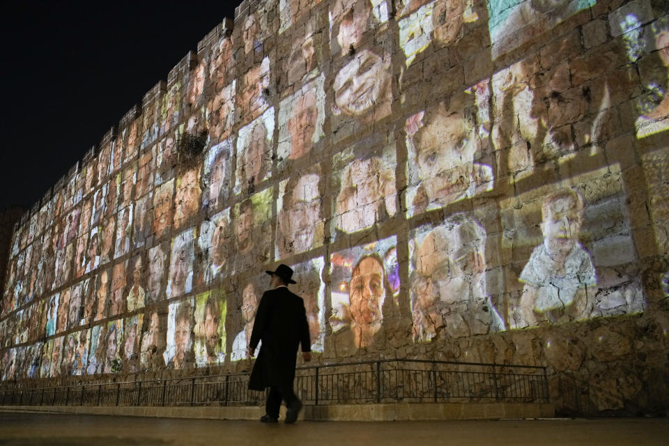 Pictures of Israeli hostages held by Hamas militants are projected on the walls of Jerusalem's Old City.  (AP file photo)