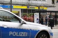 Security forces are seen after a knife attack in a supermarket in Hamburg. REUTERS/Morris Mac Matzen