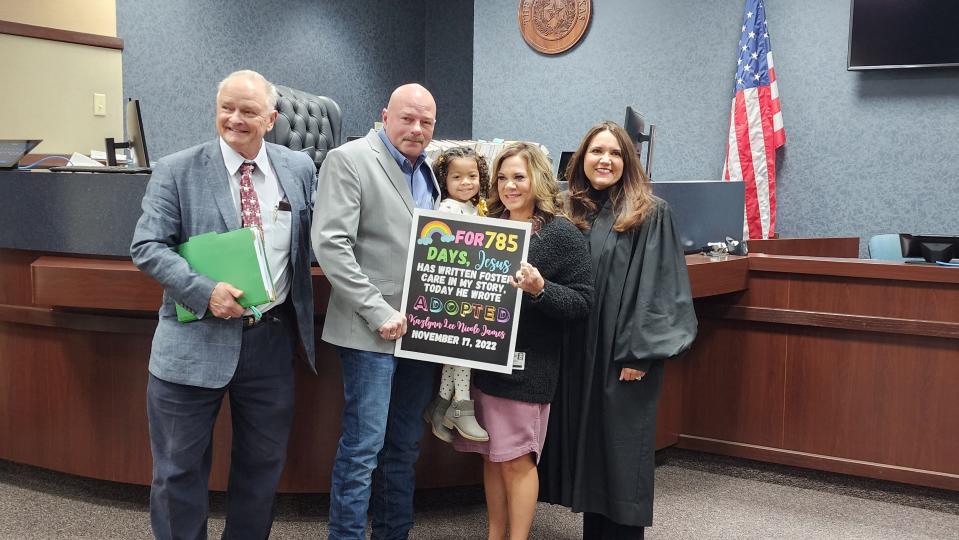 The James family celebrates its new family addition with Judge Ana E. Estevez on Nov. 17 during the National Adoption Day event at the Randall County Courthouse in Canyon.