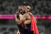 France's Makunda Gauthier, right, and guide Lucas Mathonat celebrate after the men's 400m T11 at the 2020 Paralympics at the National Stadium in Tokyo, Sunday, Aug. 29, 2021. Paralympic Games begins on Monday, May 20, 2024 and features three Paralympic athletes alone in an empty stadium with the slogan: “Il ne me manque rien, sauf vous” (I’m not missing anything, except you). (AP Photo/Eugene Hoshiko, File)