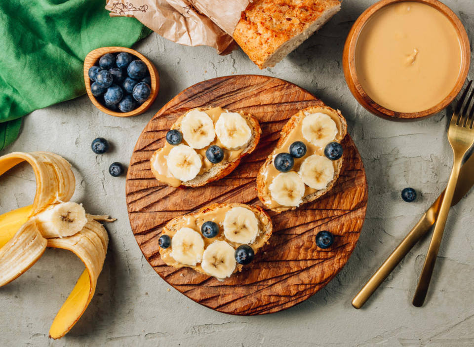 peanut butter toast with blueberries and bananas