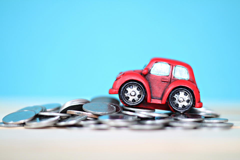 Business, finance, saving money or car loan concept : Miniature car model and coins on desk table. Source: Getty Images