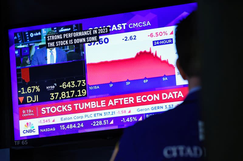 Traders work on the floor of the NYSE in New York