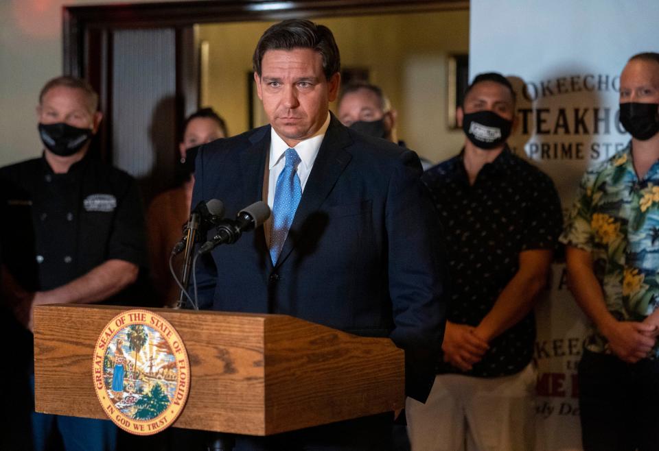 Florida Governor Ron DeSantis speaks during a press conference at the Okeechobee Steakhouse on December 15, 2020 in West  Palm Beach, Florida. DeSantis talked about the importance of keeping restaurants open during the pandemic  to help employees earn a living.