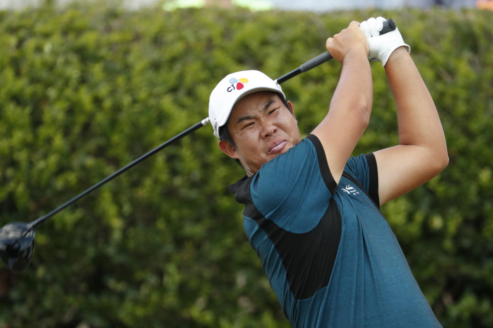 Byeong Hun An, of South Korea, grimaces as he hits his drive off the first tee during the final round of the Sanderson Farms Championship golf tournament in Jackson, Miss., Sunday, Sept. 22, 2019. (AP Photo/Rogelio V. Solis)
