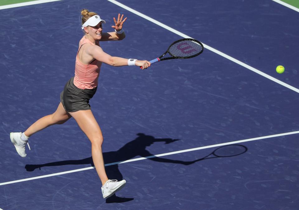 Alison Riske hits a shot at the net during her win over Caty McNally at the BNP Paribas Open in Indian Wells, Calif., March 9, 2022.
