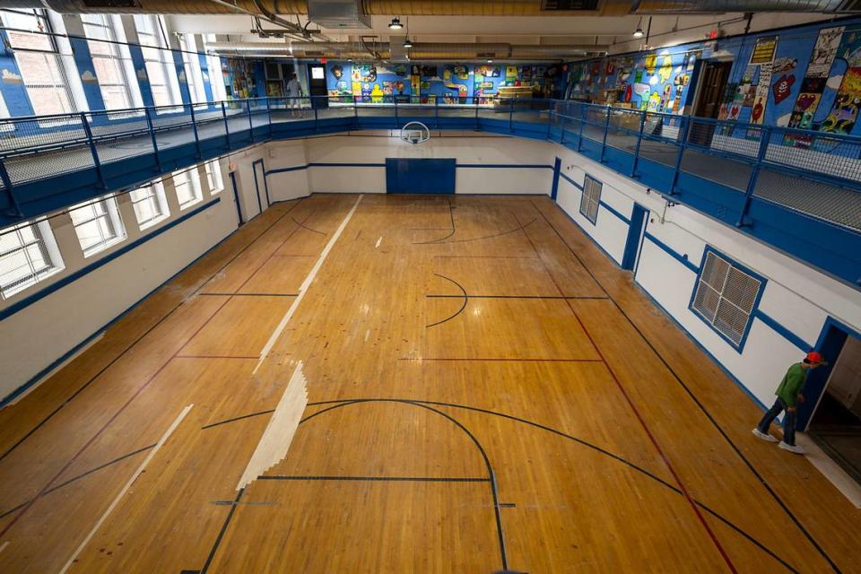 The elevated track and gymnasium original to the YMCA were left intact along with murals on the walls as a fitness center in the Y Lofts.