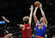 New York Knicks forward Bojan Bogdanovic (44) shoots over Toronto Raptors guard Gradey Dick (1) during the second half of an NBA basketball game Wednesday, March 27, 2024, in Toronto. (Frank Gunn/The Canadian Press via AP)