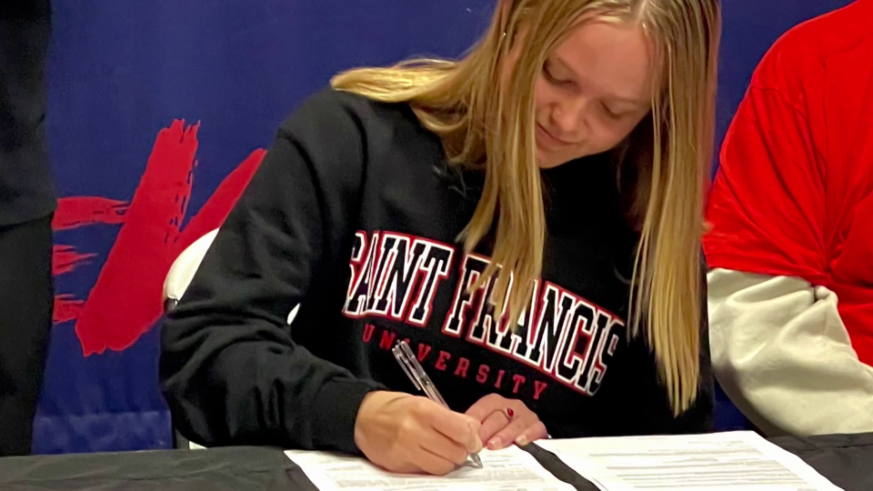 Harbor Creek senior AB Cipalla signs her letter of intent to play softball at St. Francis.