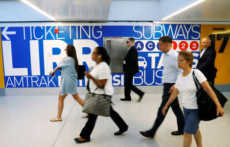 Commuters walk through New York's Pennsylvania Station which began track repairs causing massive disruptions to commuters in New York City, U.S., July 10, 2017. REUTERS/Brendan McDermid