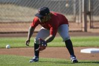 Cleveland Indians third baseman Jose Ramirez fields a ground ball during a spring training baseball practice Monday, Feb. 22, 2021, in Goodyear, Ariz. (AP Photo/Ross D. Franklin)