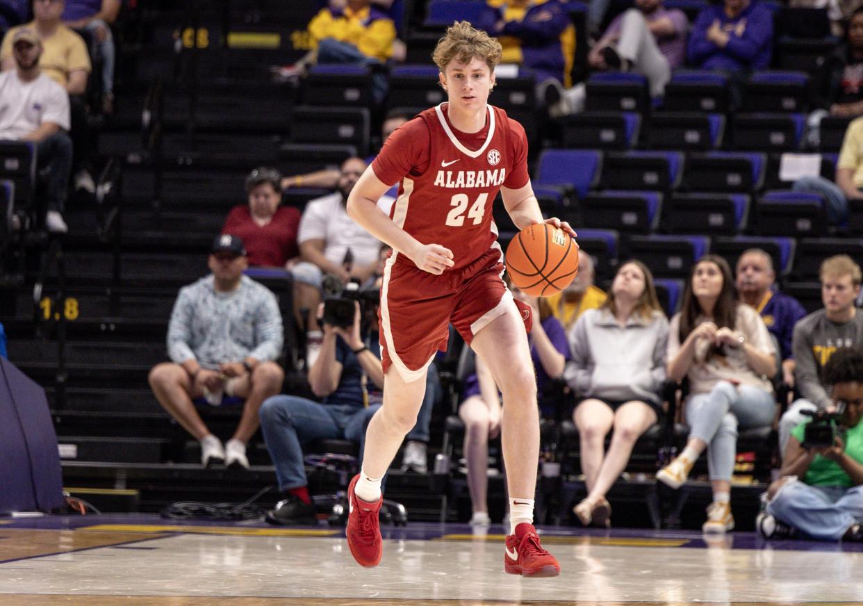 Feb 10, 2024; Baton Rouge, Louisiana, USA; Alabama Crimson Tide forward Sam Walters (24) brings the ball up court against the LSU Tigers during the second half at Pete Maravich Assembly Center. Mandatory Credit: Stephen Lew-USA TODAY Sports