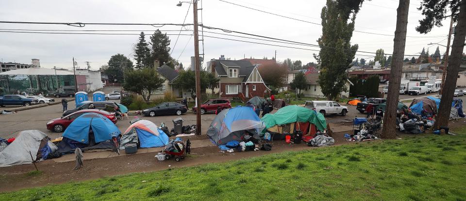 Tents line MLK Way in Bremerton as the encampment is cleared on Wednesday, Nov. 1, 2023.