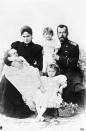 <p>Nicholas II and Alexandra pose with their three daughters, Olga, Tatiana, and Maria. </p>