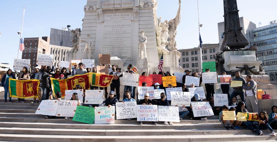 Sri Lankan Americans gather on April 3, 2022, beside Monument Circle in Indianapolis for a demonstration voicing solidarity with Sri Lankans suffering through an unprecedented economic crisis.