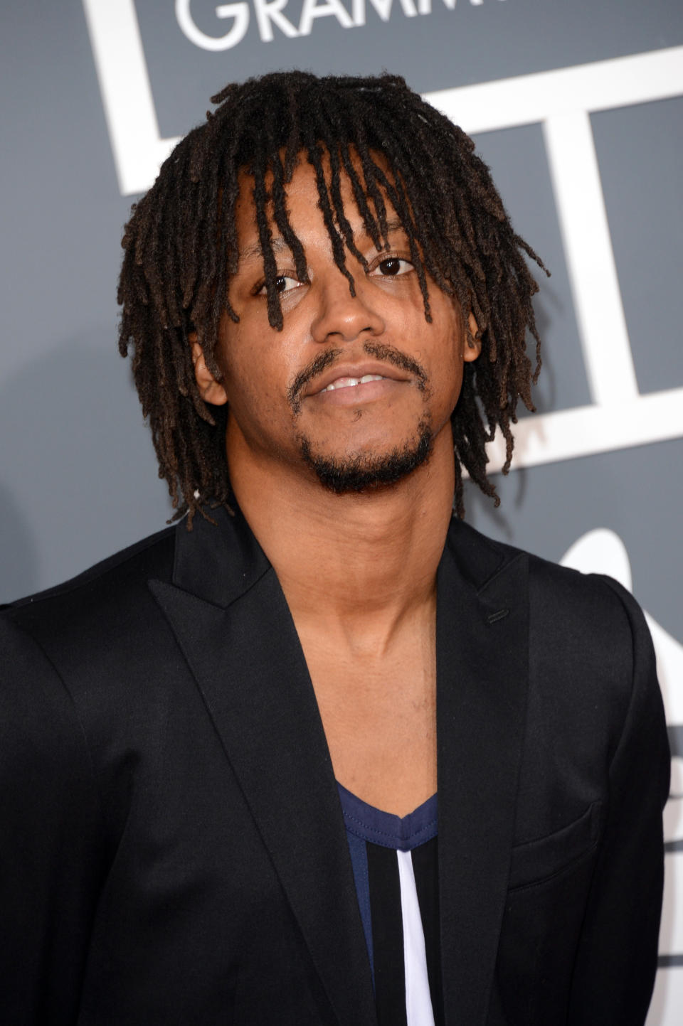 Lupe Fiasco Wearing Black Blazer