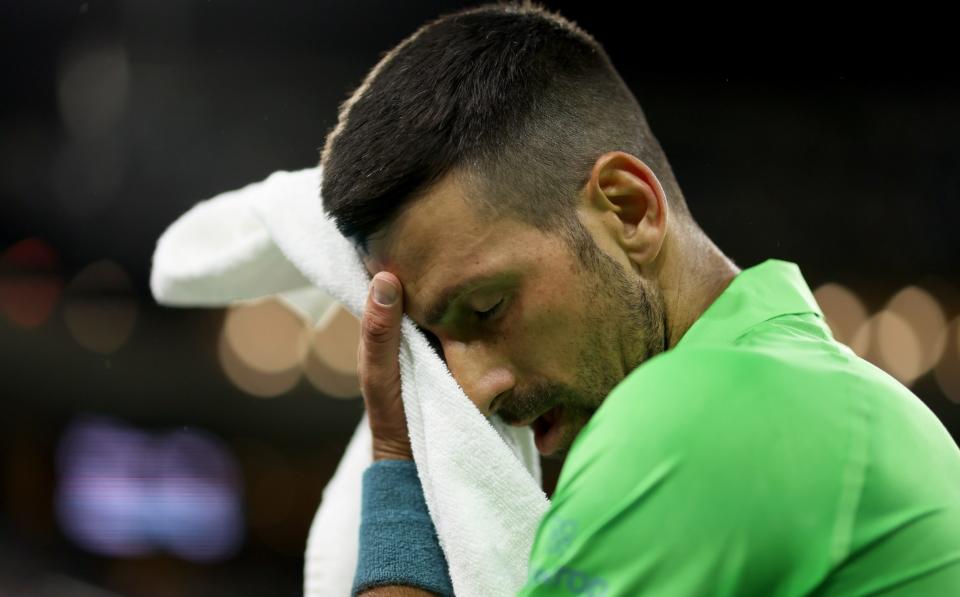 Serbia's Novak Djokovic shows his regret over his three-set defeat against Italy's Luca Nardi during their third-round match at the BNP Paribas Open at Indian Wells Tennis Garden on March 11, 2024 in Indian Wells, California.