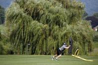 Pittsburgh Steelers tight end Heath Miller works on a blocking sled during the first practice at their NFL football training camp in Latrobe, Pa., Saturday, July 26, 2014. (AP Photo)