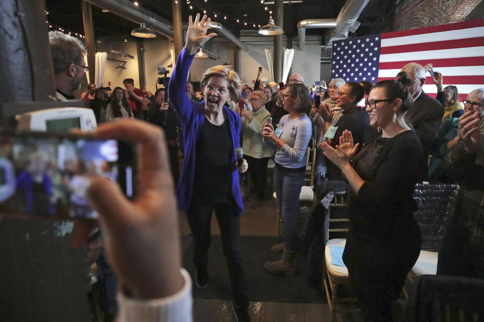 Democratic presidential candidate Sen. Elizabeth Warren, D-Mass., waves as she is introduced at a campaign stop in Dover, N.H., Friday, Jan. 10, 2020. (AP Photo/Charles Krupa)