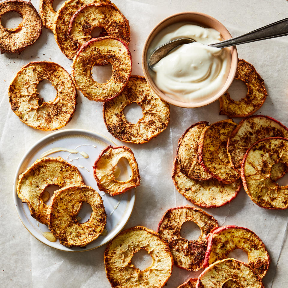 <p>When you're in the mood for a sweet snack, these air-fryer apple chips are the perfect choice. Sprinkle Honeycrisp apples with warming spices, such as cinnamon, ginger, allspice, cloves, nutmeg and cardamom. Air-fry, then dip into honey- or vanilla-flavored yogurt. <a href="https://www.eatingwell.com/recipe/8020717/air-fryer-cinnamon-ginger-apple-chips/" rel="nofollow noopener" target="_blank" data-ylk="slk:View Recipe;elm:context_link;itc:0;sec:content-canvas" class="link ">View Recipe</a></p>