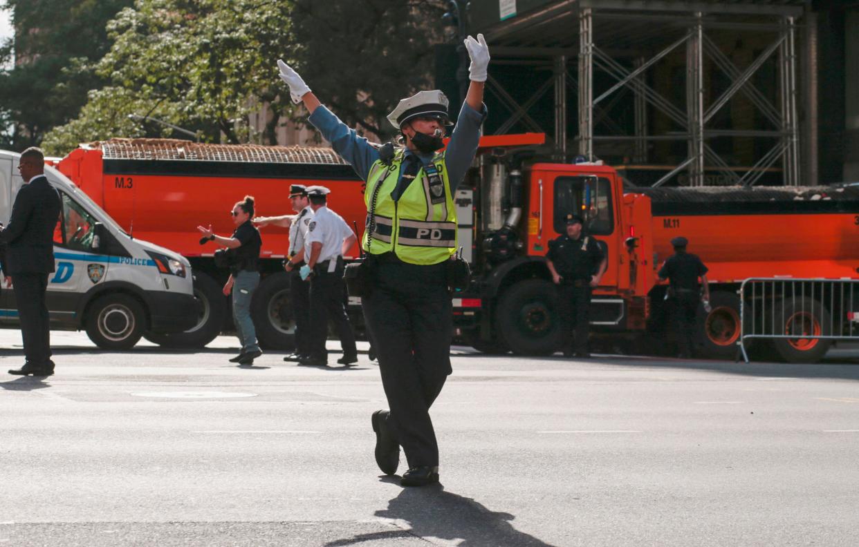 A police traffic officer gestures as traffic is restricted due to the high-level 76th session of the UN General Assembly taking place on Sept. 20, 2021, in New York.