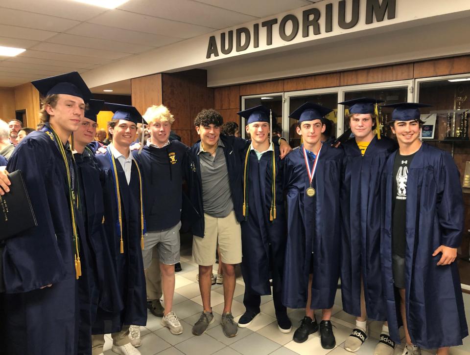 Victor senior boys lacrosse players celebrate graduation a day after they were supposed to, but they did it together.