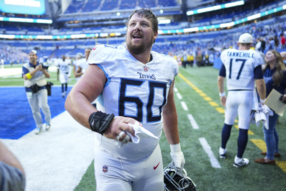 Tennessee Titans center Ben Jones throws a glove to a fan following an NFL football game against the Indianapolis Colts in Indianapolis, Fla., Sunday, Oct. 2, 2022. The Titans defeated the Colts 24-17. (AP Photo/AJ Mast)