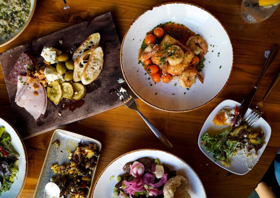 Louvino's Devour Indy menu dishes sits on a table Tuesday, August 24, 2021, at Louvino on Massachusetts Avenue, Indianapolis.