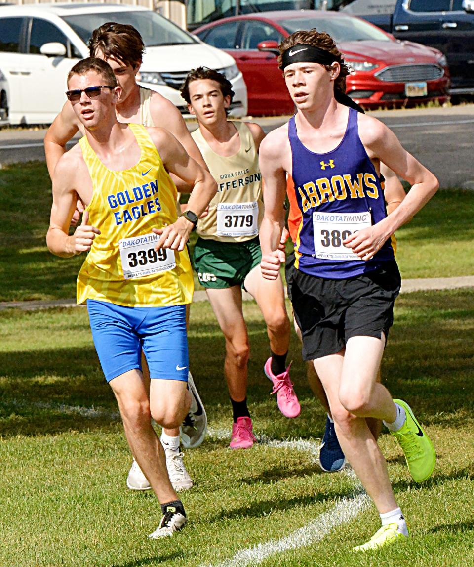 Watertown's Bayley Steiner and an Aberdeen Central  runner compete in the varsity boys' 5,000-meter race Thursday, Sept. 29, 2022 during the Watoma Invitational cross country meet at Cattail Crossing Golf Course.